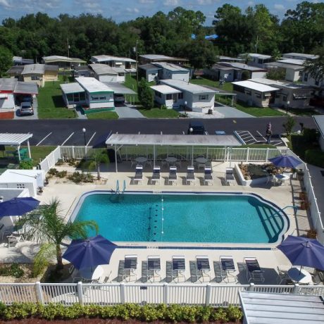 aerial view of pool and shuffleboard court